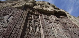 a row of khachkars at Geghard Monastery