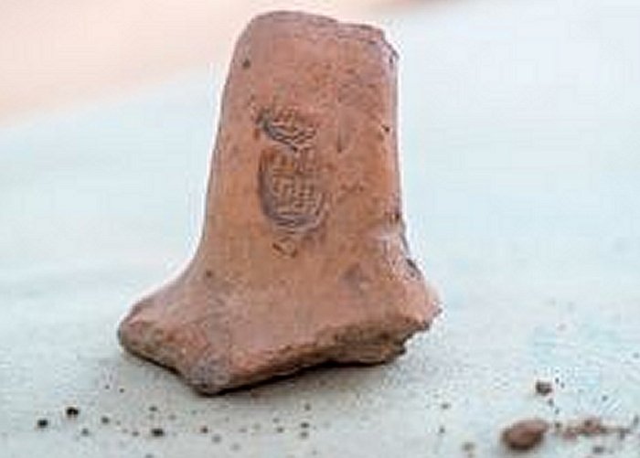 A stamped jar handle dating to the Middle Bronze Age.Israel Antiquities Authority