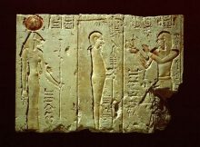 Panel A shows Ptolemy II Philadelphus standing before Ptah, adoring him and presenting with his right hand a statuette of Ma'at to the god. Image via Global Egyptian Museum