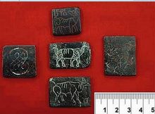 Selection of Mohenjo-daro copper tablets. Scale in cm. Image courtesy of Harappa Archaeological Research Project/Harappa.com and Dept. of Archaeology and Museums, Govt. of Pakistan.