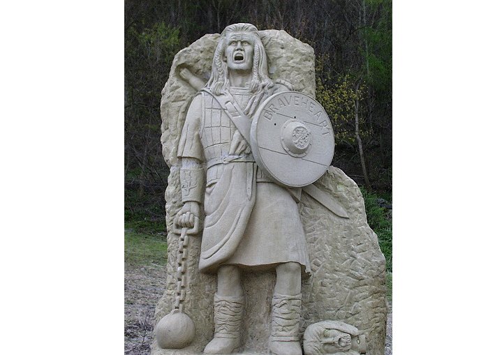 This statue stands at the base of the William Wallace Memorial near Stirling Castle in Scotland.