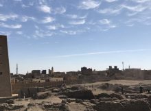 The excavation site at Tell Edfu (with the temple of Horus and the modern town of Edfu in the background). Photo byG. Marouard