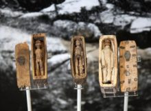 Three of the miniature coffins on display in the National Museum of Scotland. Image credit: The National Museum of Scotland