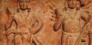 Agni (right) with his son Skanda (Karttikeya), about 1st-century CE.