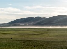 The sand dunes of Mongol Els jutting out of the steppe in Mongolia. Many of these desert barriers only appeared after the Last Glacial Maximum (~20,000 years ago). © Nils Vanwezer