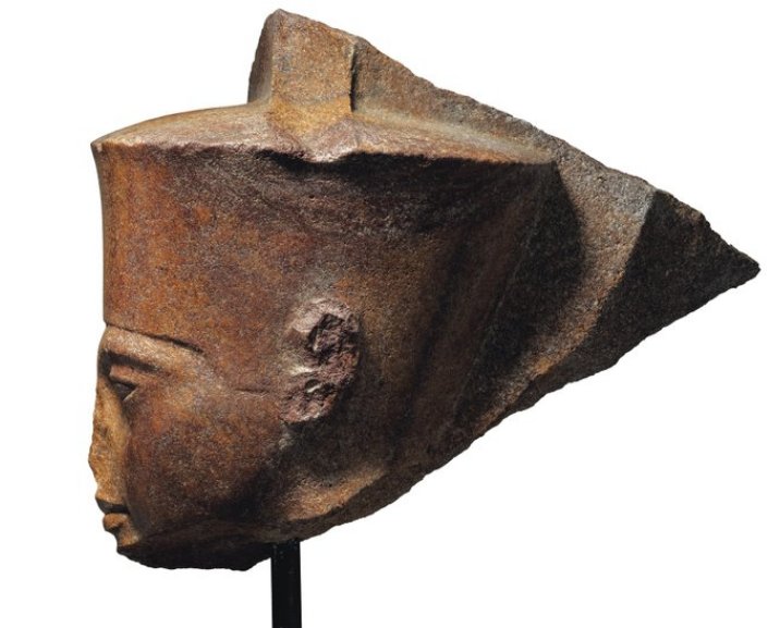 This image released by Christie's on Tuesday, June 11, 2019, shows a 3,000-year-old stone sculpture of the famed boy pharaoh Tutankhamun at Christie's in London. Egypt is trying to halt the auction of the sculpture of Tutankhamun at Christie's in London. The Foreign Ministry issued a statement late on Monday saying Egyptian authorities demand the auction house provide documents proving the artifact's ownership. (Christie's via AP)