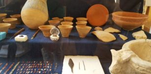 Various finds including ring, metal objects and pottery vessels.