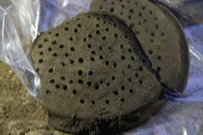 A perforated lid of a terracotta pipeline that could have been used as a filtering device, found during 5th phase of excavation at Keeladi.