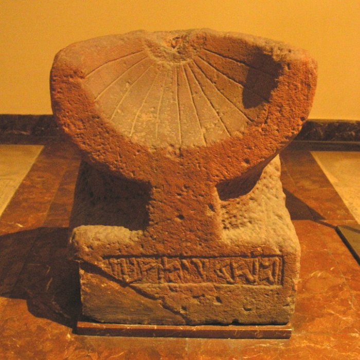 A sundial inscribed in Aramaic was found in Madain Saleh, dating back to the first century BC .