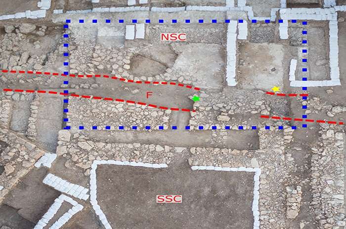  Aerial view showing the Southern Storage Complex (SSC), the Northern Storage Complex (NSC; blue dashed box) and the trench (red dashed lines) Credit: Eric Cline/GW