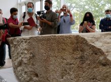 Photographers take pictures during the presentation to the press of an archeological finding that emerged during the excavations at a Mausoleum in Rome, Friday, July 16, 2021. (AP Photo/Domenico Stinellis)