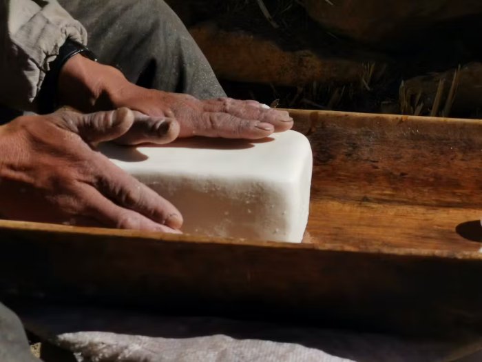 Modern Tibetan pastoralists make butter from yak milk. Li Tang, Author provided